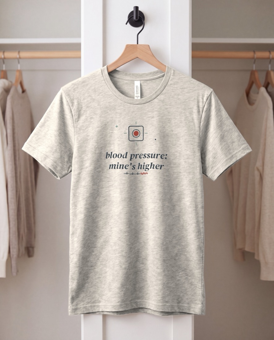 Blood Pressure: Mine's Higher tee, hanging on a peg rail