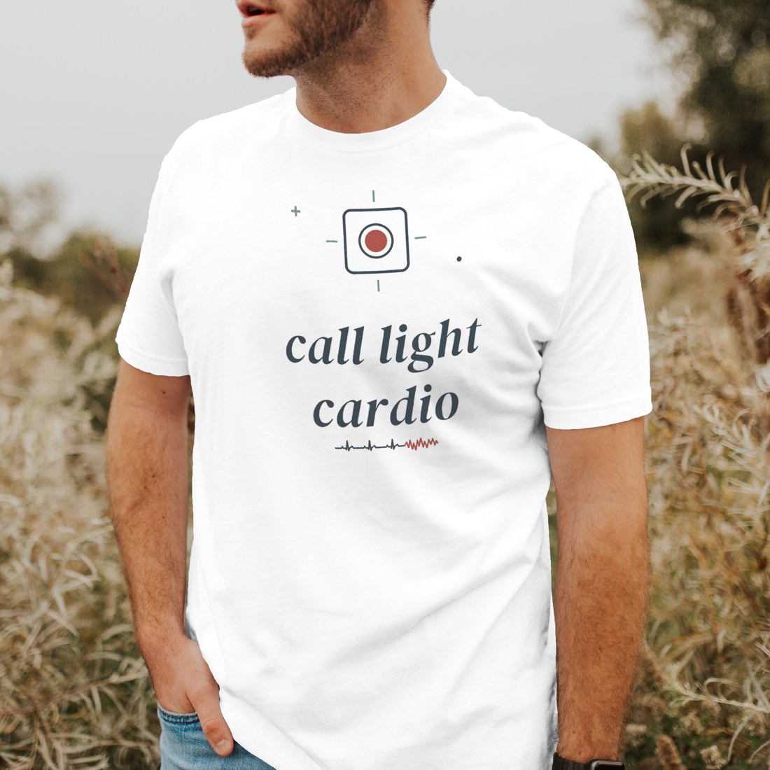 White tee reading “call light cardio” in a clean studio front shot
